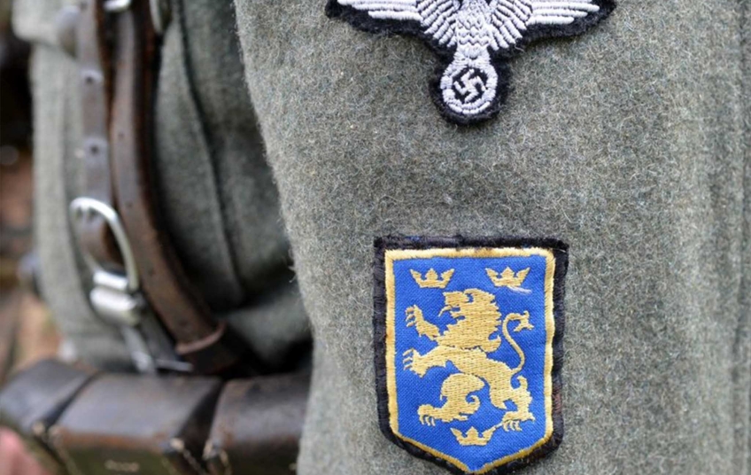 Rukávová insignie divize SS Galizien s lvem a třemi korunami pod znakem Waffen-SS